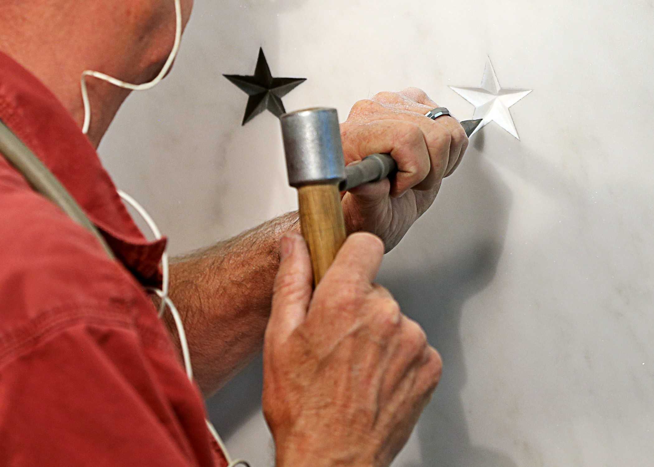 Stone being carved into the wall