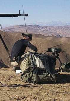 A Special Operations Forces soldier with weapons and supplies at his station in Afghanistan.